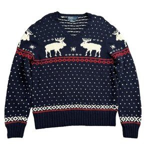 Crafted with heavyweight wool yarns, this sweater has reindeer and snowflakes